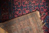 Tattered fringe and hand-knotted foundation of the Persian Lilihan rug.