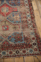 Antique Caucasian rug: threadbare pile, exposed foundation, geometric pattern.