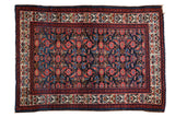 Vintage Malayer rug with allover Herati motif, deep indigo field, and ruby red details.