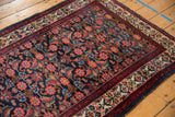 Vintage Persian Malayer rug: sapphire Herati field, ruby blossomed border, and blue selvage.