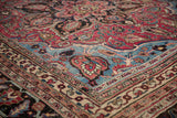 Vintage Persian Doroksh carpet corner with intricate floral vinery and patterned ruby, sapphire, ivory borders.