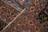 Vintage Doroksh carpet corner, with intricate floral borders, gem-tone patterns, and natural fringe.