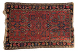 Vintage Lilihan rug, raspberry red field, sapphire blue floral vinery, mostly even wear.