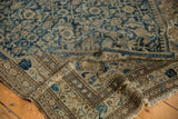 Distressed Malayer rug, close-up with worn low pile, visible foundation, faded blue Herati motif.