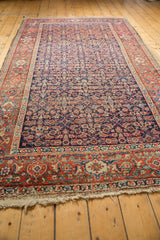 Antique Persian Fereghan carpet's Herati pattern on navy field with brick red border.