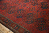Antique Ersari carpet: chestnut red field, navy gul florals, delicate vine, geometric border, low pile.