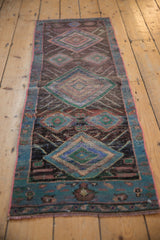 Distressed vintage Oushak rug texture with layered denim blue and mallard green diamond pattern.