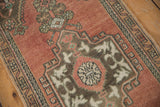 Textural dusty rose field with oxidized geometric patterns and visible wear.