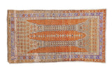 Distressed Oushak rug in pale orange, sand, lavender with double column pattern, 2'5
