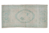 Distressed Oushak rug runner with ivory and seafoam green floral cameo medallion, 2'8
