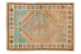 Distressed vintage Oushak square rug featuring turquoise, beige, and coffee brown diamond medallion.