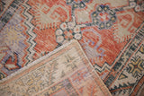 Hand-knotted Distressed Oushak rug, worn pile revealing foundation, with brick red and pale blue.
