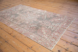 Vintage distressed Sparta rug, faded red floral pattern, oxidized silver, visible foundation.