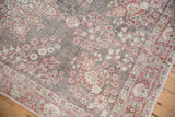 Distressed Vintage Sparta rug, cherry red floral patterns, oxidized silver, visible foundation.