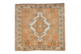 Vintage Distressed Oushak rug with terracotta field, ivory medallion, starburst florals.