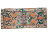 Distressed vintage Oushak runner, tangerine orange field, blue and green scrolling floral medallion, 2'6