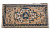 Distressed Oushak rug, indigo blue stepped medallion, beige field, floral accents. 1'10