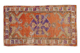 Vintage distressed Oushak rug with burnt orange abrashed field, violet medallion, 2'7