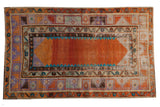 Distressed Oushak rug with abrashed tangerine field and layered geometric pastel borders, 3'1
