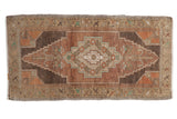 Distressed Oushak rug mat, stepped medallion, abrashed brown, aubergine, beige tones.