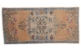 Distressed Oushak runner, central medallion, blue cloud band corners, abrashed beige field. 2'5