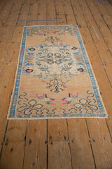 Distressed Oushak runner with mostly even wear and vibrant blue, pink motifs.