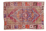 Distressed Vintage Oushak rug: oversize central medallion, unusual jade green spandrels, royal blue, aubergine.