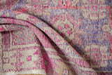 Textured vintage distressed Oushak rug pile with pops of blush pink and pale aubergine.