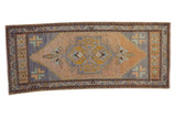 Distressed vintage Oushak rug runner, central finned floral motif, blue, beige, gold colors, 1'9