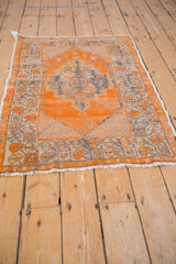 Distressed vintage Turkish Oushak rug, pale tangerine abrashed field, floral border texture.