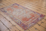 Worn pile texture of a Vintage Oushak rug, with terra cotta and ivory geometric border.