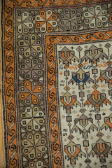 Tangerine geometric border and stylized serrated floral field motifs with intact side selvage.