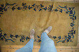 Chinese Art Deco runner with gold field and intricate blue floral vinery.