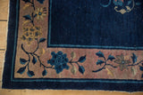 Vintage Chinese Art Deco rug border with mauve and cobalt blue blossomed branches.