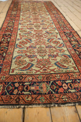 Vintage Hamadan runner's repeating Herati motif on ivory ground with sapphire, emerald, and blush.