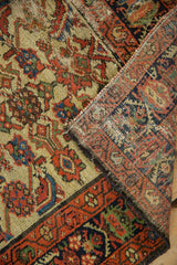 Vintage Hamadan runner folded, showing ivory Herati pattern with sapphire blue, and woven back.
