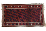 Antique Belouch rug with a staggered lattice of floral guls in madder red and cobalt blue.