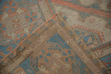Distressed vintage Soumac flatweave rug, highlighting original selvage and time-softened blue.