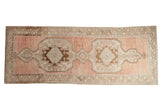 Distressed vintage Oushak runner, abrashed dusty raspberry field and chocolate brown medallions.