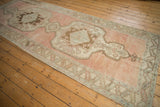 Vintage Oushak runner: heavily abrashed dusty raspberry field with serrated leaf main border detail.