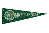 Vintage 1950s Michigan State University felt pennant, green with white seal and lettering, 3.5x9.5 inches.