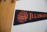 Orange University of Illinois seal and grommet holes on dark blue felt flag.