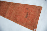 Reverse side of the vintage felt pennant showing weathered texture and dark staining.