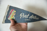 Angled view showing the felt texture and script on the Port Arthur pennant.