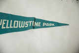 Vintage Yellowstone Park felt pennant detail, showing white 'STONE PARK' text and pointed tip.