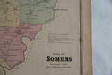 Antique Somers NY map detail, showing the town title, business directory, and ornate border.