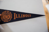 Vintage dark blue felt pennant with orange University of Illinois seal and letters.