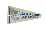 Vintage Air Force Academy felt pennant, faded blue print on aged cream, 3.5