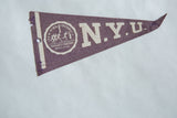 Left edge of vintage NYU felt pennant, showing white stripe, punch hole, and tears.