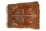 Antique Persian Tabriz rug with a tree of life and pomegranates on a pale rust ground.